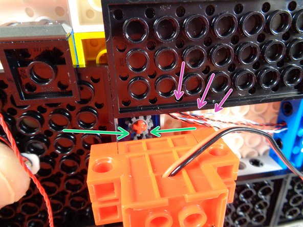 As shown by the green arrows in the second photo, make sure the two gears mesh together, so the motor will turn the roof radar.