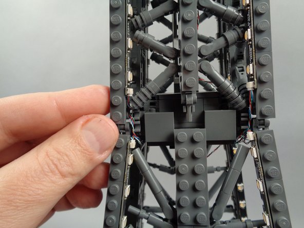 As shown in the photos for this step, you can use the tweezers to tidy up any visible sections of wire connecting the 17-LED sections and 20-LED sections of both light strips.