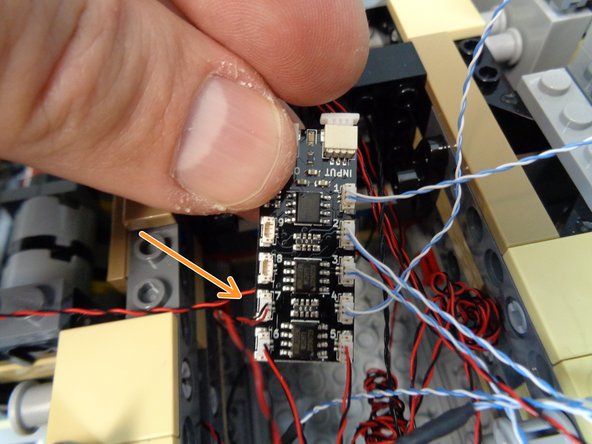As shown by the photo in this step, connect the table light to plug #7 on the third BRANCH09X adapter board.