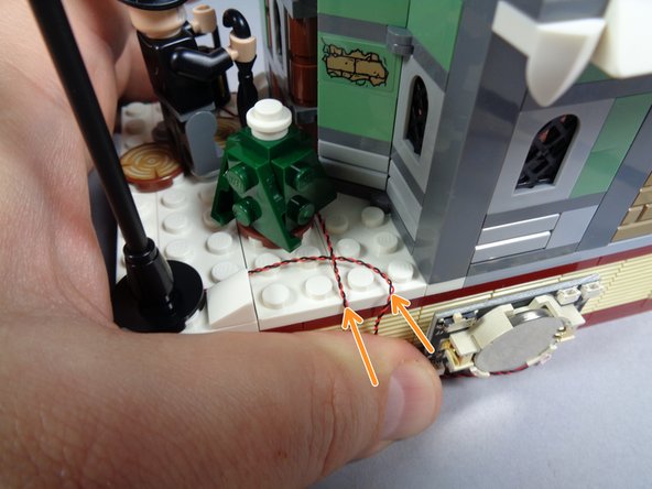 As shown in the third photo, re-attach the black gate.