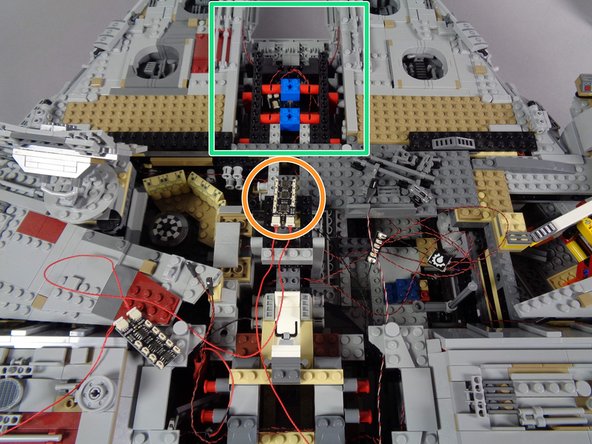 As shown in the second photo, carefully remove the top center section of the Falcon (see the green square).
