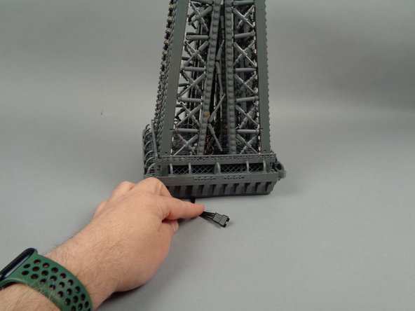 As shown in the photo for this step, your upper Eiffel Tower section should now be re-assembled and complete.