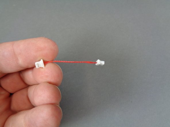 Also inside the &quot;Lower Level Lights and Parts&quot; bag will be a short (2.5&quot;/6.3cm) red wire with plugs on both end as shown in the first photo.