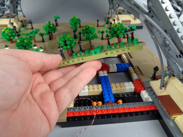 As shown in the photos for this step, remove the large center Panel 2.