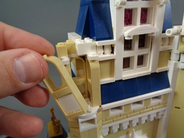 As shown in the first photo for this step, continue disassembling the turret next to the bedroom by removing the front panel.