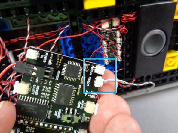 Note the green square in the first photo, showing the speaker attached with its wire pointing toward the main controller.  This is how you should attach your speaker as well.