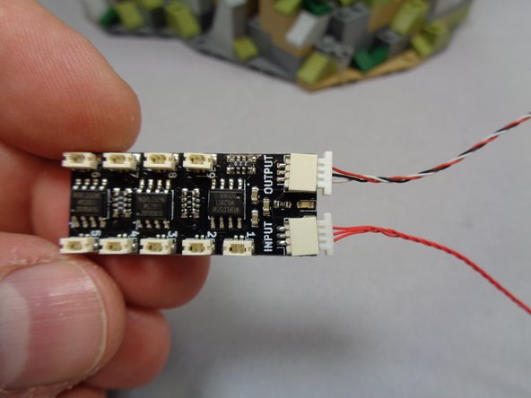 Remove the BRANCH09X adapter board from Bag 10.