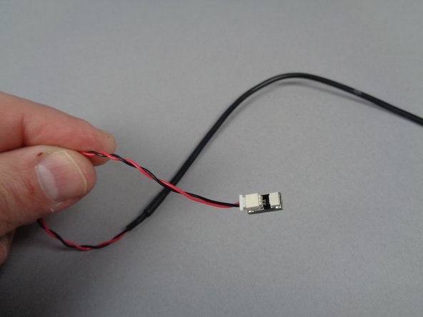 Remove the testing board from its bag-- the board has a large plug and a small plug as shown in the second photo for this step.