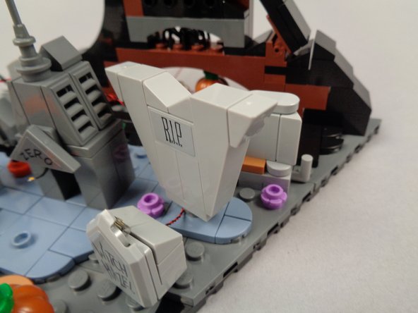 As shown in the second photo, route the LED light wire to the left of the 1x1 plate and pass it toward the back.