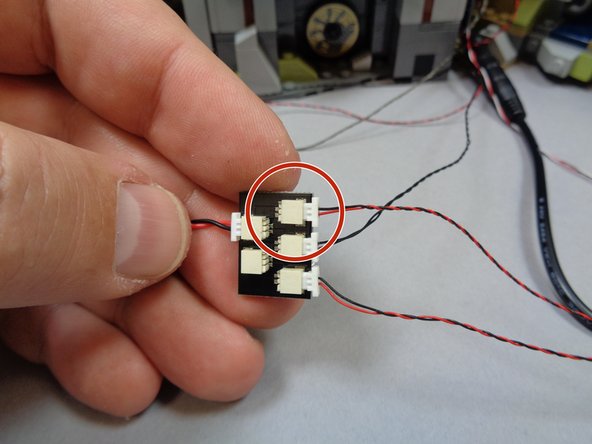 Behind your castle, you should have a BRANCH18 adapter with five plugs from when you installed the main light and sound kit.  There should be two open plugs on the BRANCH18 adapter board.