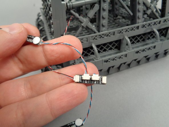 As shown in the first photo for this step, you will begin with the LED light strips connected to plug #1 on the adapter board.
