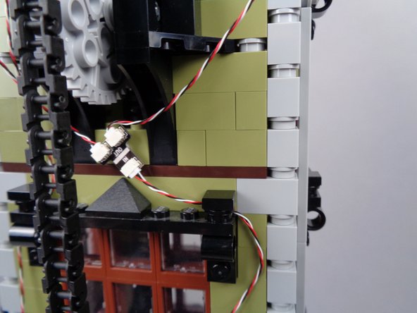 As shown in the photos for this step, begin routing the light strip wire using the same approach you used for the magnetic switch wire, except on the right side of the window frames this time.