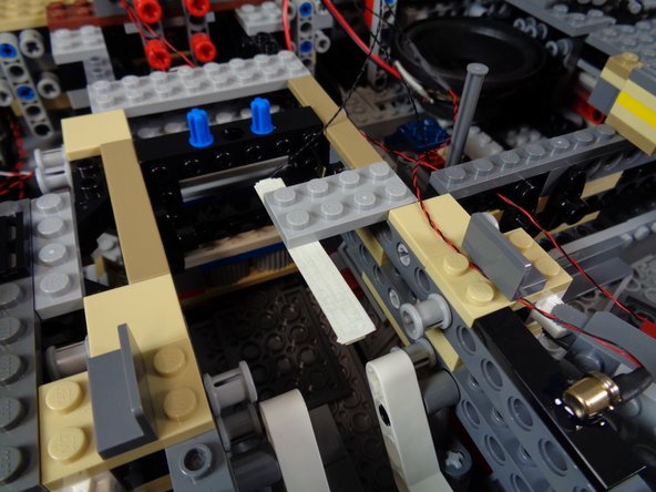 As shown in the first photo, connect one plug from the magnetic connector assembly to one end of the cool white light strip.