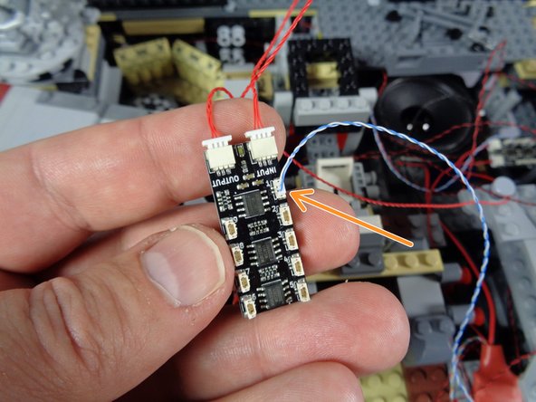 As shown by the orange arrow in the third photo, connect the small plug from this cable to plug #1 on the BRANCH09X adapter board.