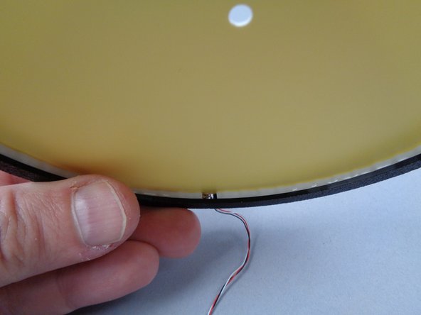 The frames are designed with just enough room for the light strip and the paper moon to press into place.  If any sections of your light strip pop out of place while pressing the paper moon into position, you can re-position the strip and try again.