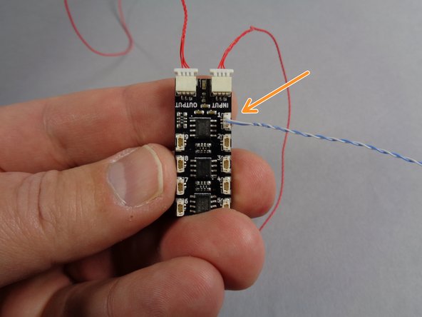 Take one of the cables out of the Main Parts bag, and leave the other one in the bag for later.