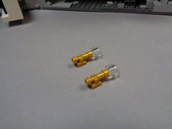 As shown in the second photo, remove the two gold wall sconces from the bedroom wall.