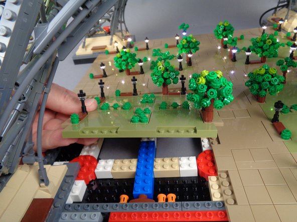 As shown in the three photos for this step, remove the large Panel 3 next.