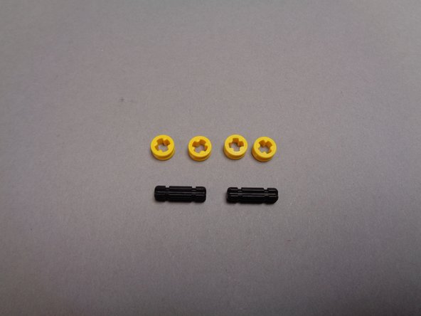 Also inside the large pink bag with the main controller will be six LEGO parts, which you will use to mount the controller inside the base of your Eiffel Tower.