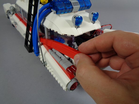 Now you will repeat the same steps to mount two red Pico LED lights in the upper left tail light.