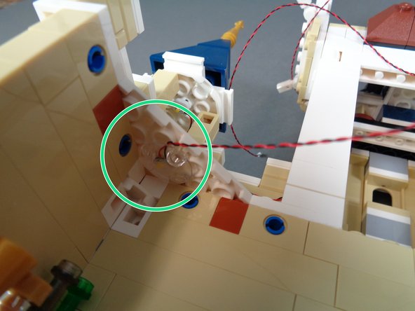 As shown in the photo for this step, take another warm white Pico LED light and mount it using another clear &quot;boat stud&quot; piece in the corner of the kitchen ceiling.