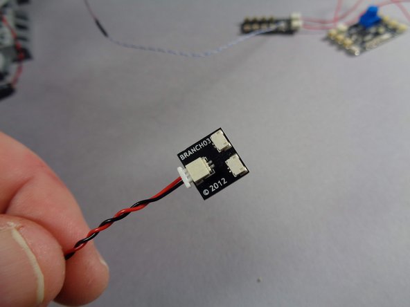 Inside the Main Parts bag for your new kit, there will be an adapter board labeled BRANCH03.  This adapter board is shown in the second photo for this step.