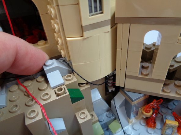 As shown in the first photo, run the 12&quot; black cable up toward the base of the tower.