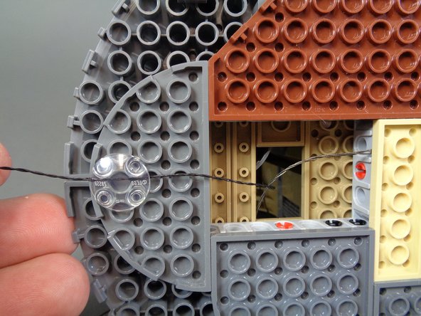 This time, you will be using the 2-wire cable, not the 3-wire cable you should have already fed through the base of the castle.