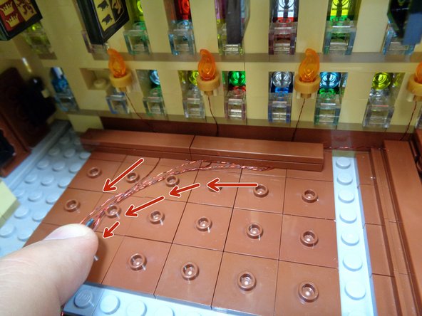 Remember to leave a little extra slack in the wire along the wall so the light won't be pulled from the torch when you re-attach the benches.