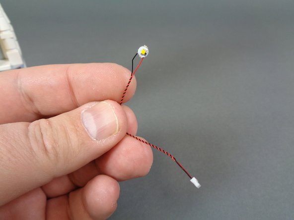 As shown in the first photo for this step, take the warm white Pico LED light with 3&quot;/7.6cm wire out of the &quot;Upper Level Lights and Parts&quot; bag.  This will be the LED light with the shortest wire in the bag.