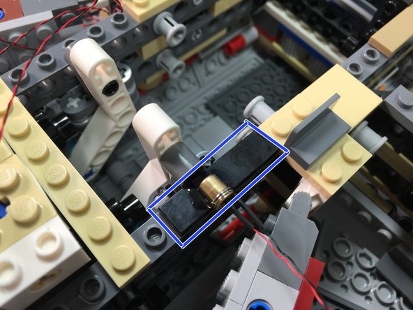 Attach the magnetic switch assembly as shown by the blue rectangle in the second photo.