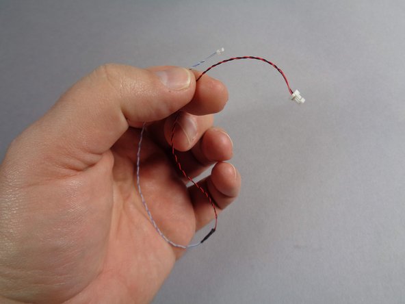 Inside the Main Parts bag, you should have one last cable with a small plug on one end and a large plug on the other, as shown in the second photo.