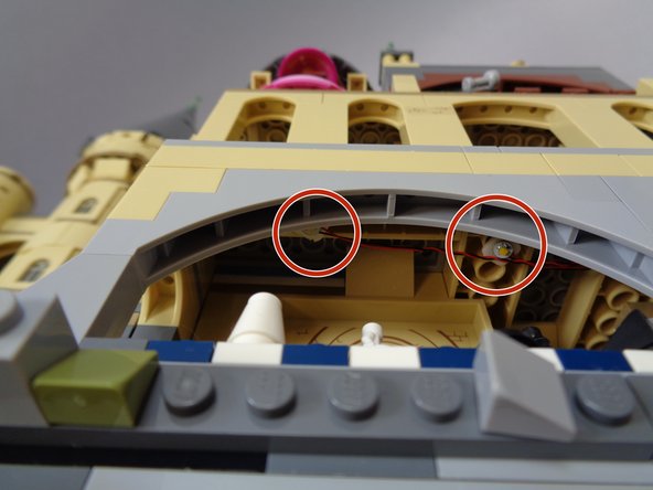 Mount the two lights on the ceiling of the Chessboard Chamber as shown by the red circles in the second photo.