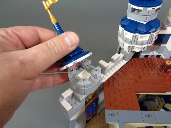 Next you will mount four warm white Pico LED lights, one inside each of the main towers on the castle wall.