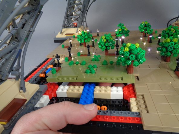 As shown in the three photos for this step, remove the large Panel 3 next.