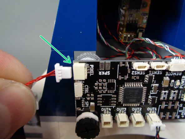 As shown by the green arrow in the first photo for this step, connect the other end of the red 1.5&quot;/3,8cm 3-wire cable to the plug on the TRUNK08 master controller labeled &quot;PIXEL.&quot;