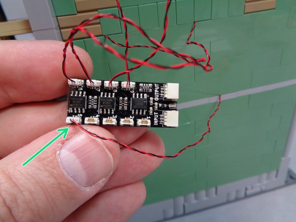 As shown by the green arrow in the second photo, connect the heart jar light to plug #5 on the BRANCH09X adapter board.