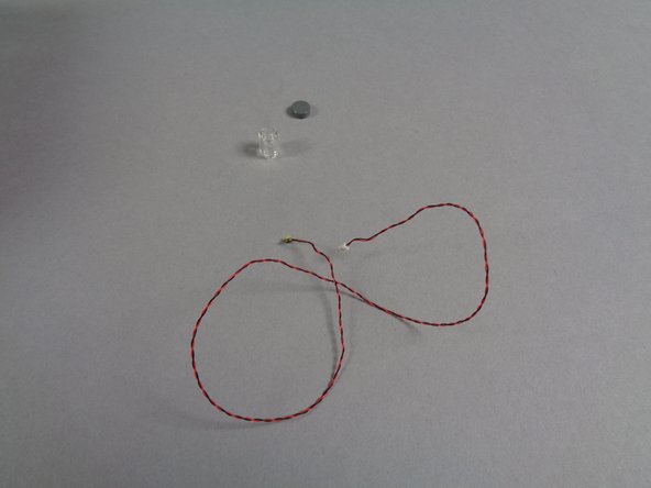 The Roof Strobe Light bag contains three parts: one cool white Pico LED, one transparent round LEGO brick, and one 1x1 round silver LEGO tile.  See the second photo.