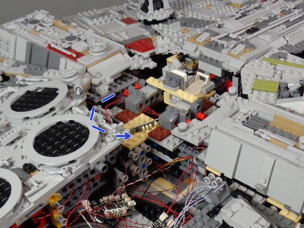 Note that some of the photos in this step show the Falcon with its top panels re-attached.   Your Falcon will still have its panels removed.  That is OK-- the steps are still the same.