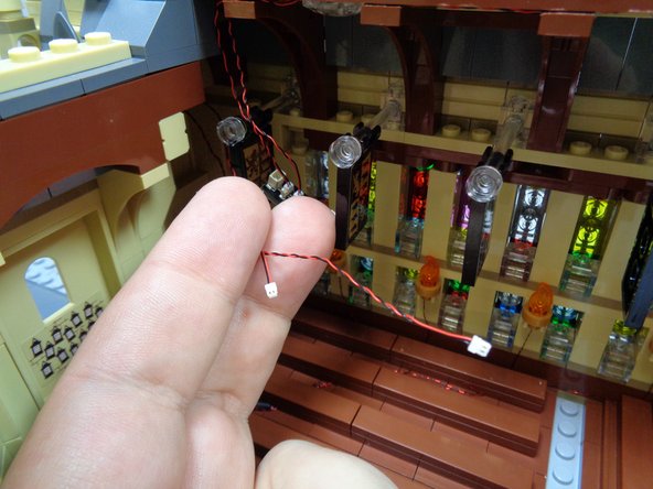 As shown in the first photo, you should now have two wires extending into the main hall.