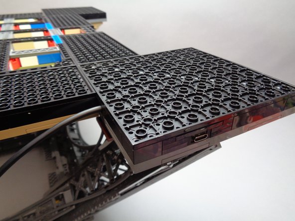 When replacing the large plate, be careful not to press too hard and cause the top side of the tower frame to come loose.  It is a good idea to support the top side of the foot with one hand while pressing down on the plate with your other hand.