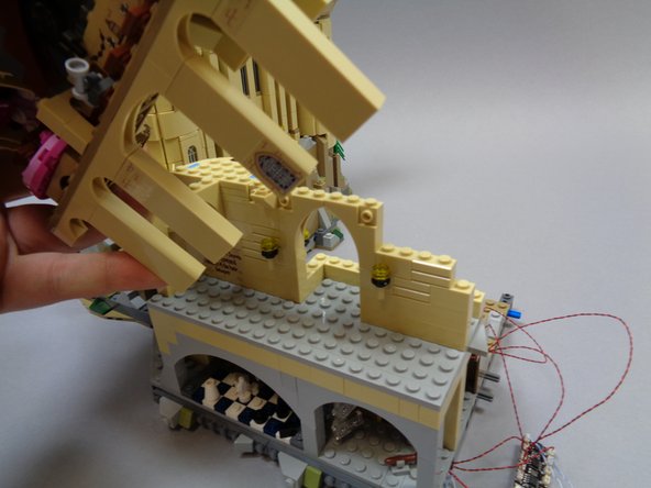 Next, disassemble the top half of the castle section shown in the second photo.  Although this seems like a lot to disassemble, the castle section should lift off as a single piece.