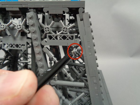As shown by the red circle in the first photo for this step, remove the small piece that supports the horizontal walkway.  This needs to be removed to make room for the light strip.