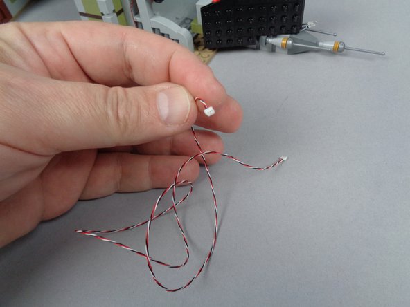 In your BOX #1, there will be a 50cm (20&quot;) connecting cable with red/white/black wires.  The first photo in this step shows what the wire looks like.  This is the control wire for the lights connected to the adapter board.