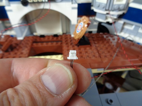 As shown by the orange rectangle in the first photo, connect one end of the red wire to the plug on the BRANCH09X adapter labeled INPUT.