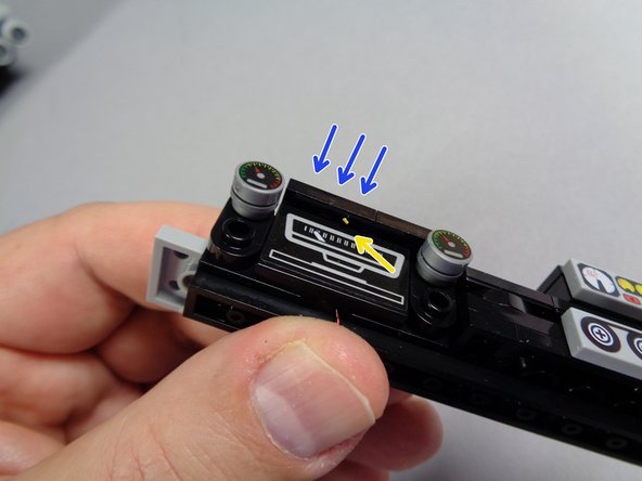 The second photo shows the LED light positioned correctly, centered above the speedometer and sticking out just a little.