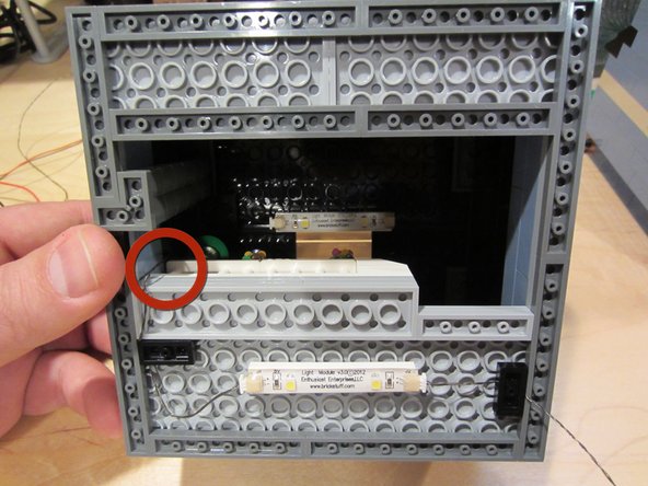 Use the holes and pathways you identified earlier to run wires between floors or between areas of your creation.