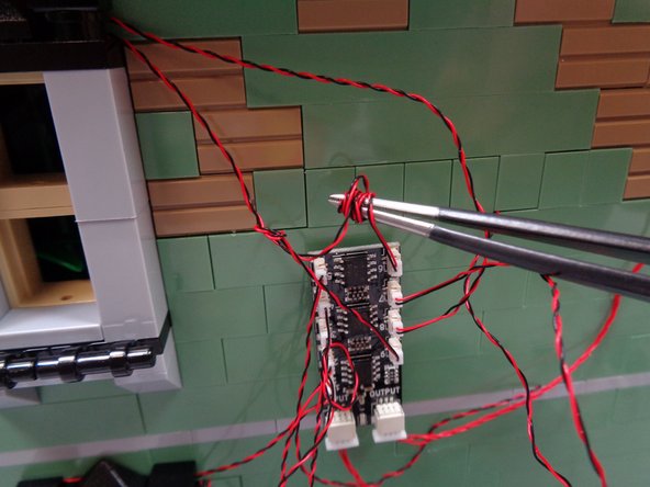 You will have extra light wires in back of the house.  You can use a tweezers or similar tool as shown in the third photo to coil up any excess light wires.