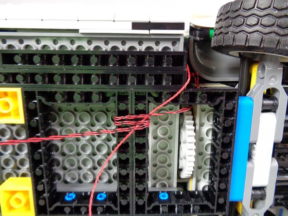 As shown by the red rectangle in the first photo, be careful to keep the wires away from the steering gear!