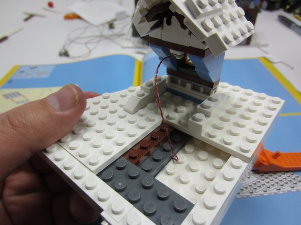 Mount inside the dormer window as shown.